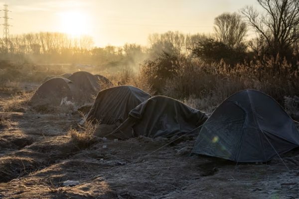 Frost-covered tents at Loon-Plage refugee camp, near Dunkirk. The four victims at the camp were understood to be two security agents and two people residing there.