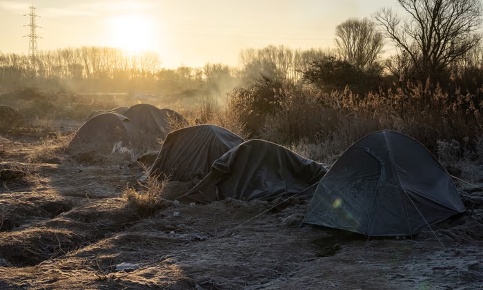 Frost-covered tents at Loon-Plage refugee camp, near Dunkirk. The four victims at the camp were understood to be two security agents and two people residing there.