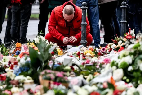 People have been leaving floral tributes for the victims of Friday's attack on the Christmas market in Magdeburg, Germany